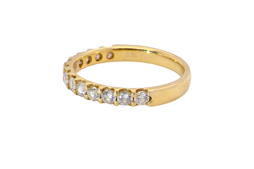 An 18 carat yellow gold half hoop diamond eternity ring originally purchased from Goldsmiths side view