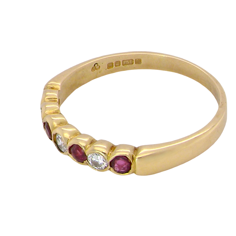 side An 18 carat yellow gold half hoop eternity ring. Set with four rubies, 3mm each.
Set with alternate diamonds, each 3mm (0.10 carats each) colour i-j, clarity Si.