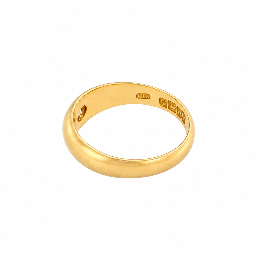 side An 18 carat yellow gold ring, sometimes referred to as a 'gypsy' ring. The diamond measures 2.4mm (0.05 carats) star set.