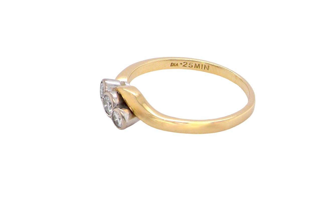 side An 18 carat yellow gold three stone ring, cross over style, and set with brilliant cut white diamonds.
Centre stone 3mm (0.10 carats)