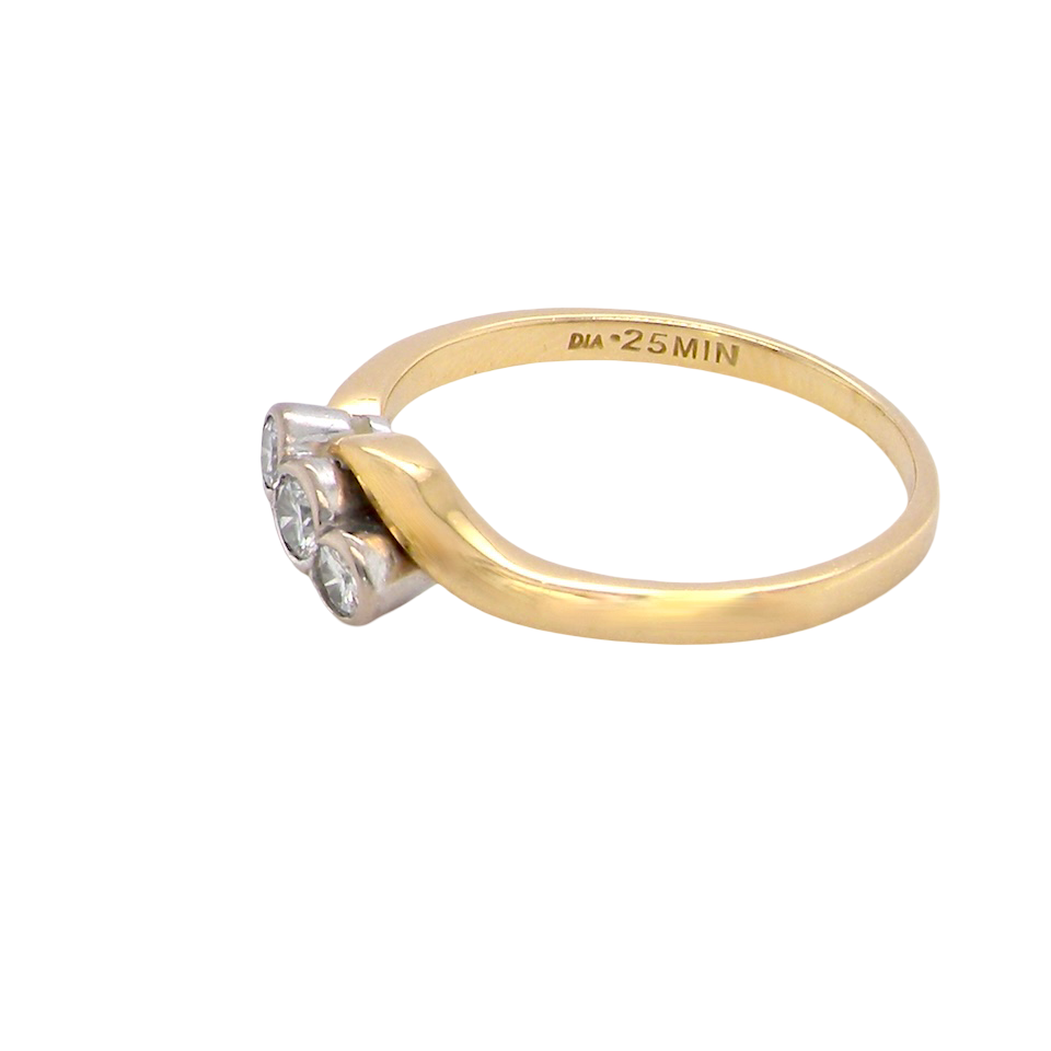 side An 18 carat yellow gold three stone ring, cross over style, and set with brilliant cut white diamonds.
Centre stone 3mm (0.10 carats)