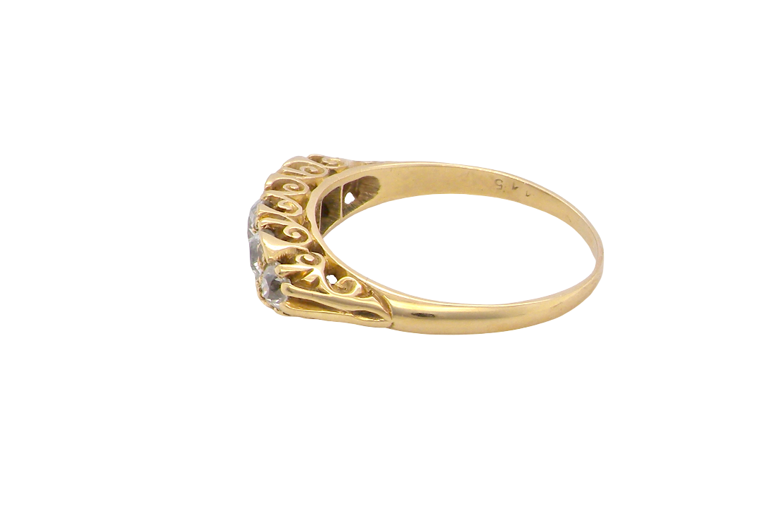 side An antique boat shaped five stone ring. Set with five old cut white diamonds. Centre 5mm (0.45-0.50 carats) each side a 4mm stone, at each end a 2.4mm stone. Total diamond content estimated at one carat.