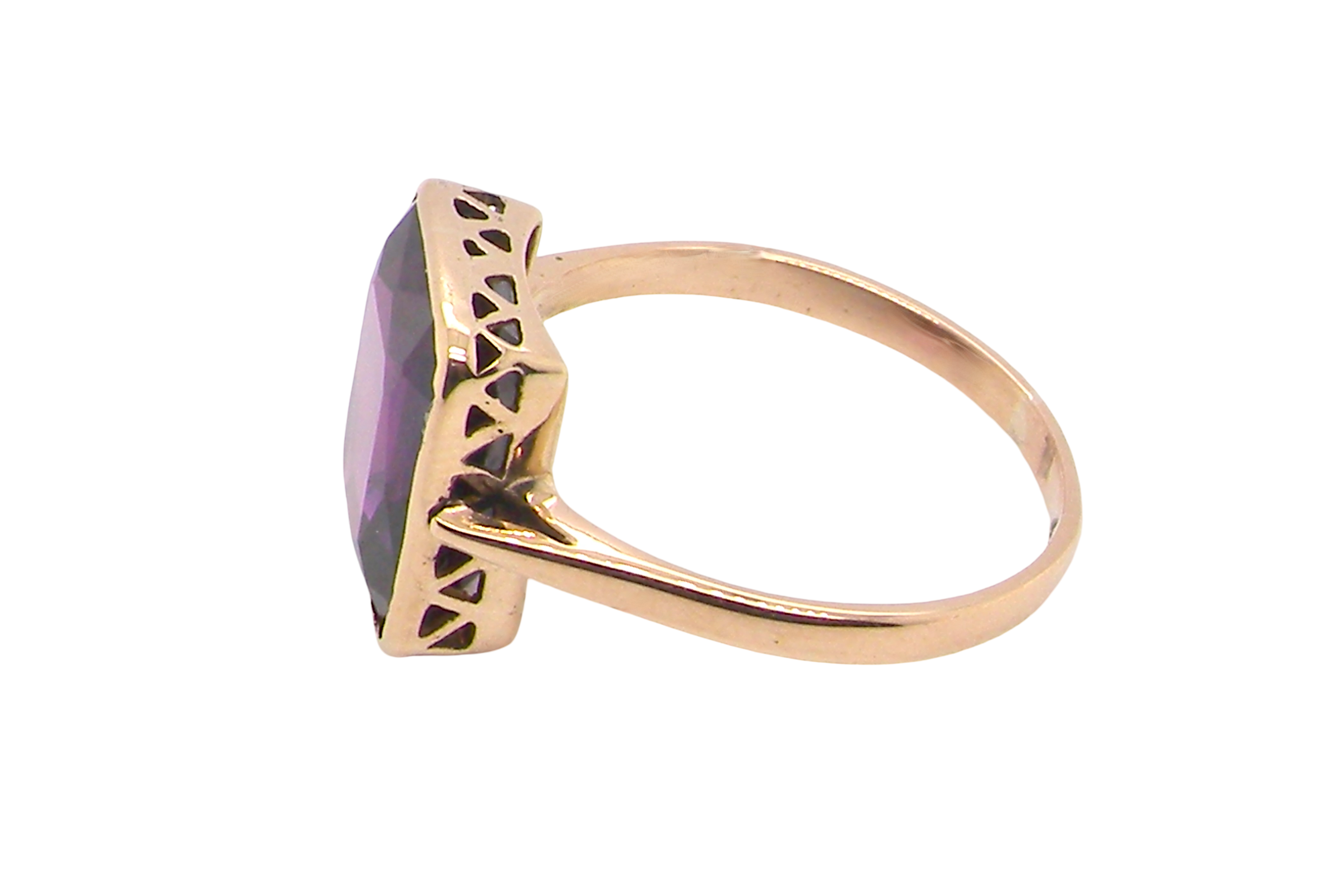 side An antique dress ring that features a rectangular cut amethyst. Very dark purple, measures 12x10mm. Rim setting.