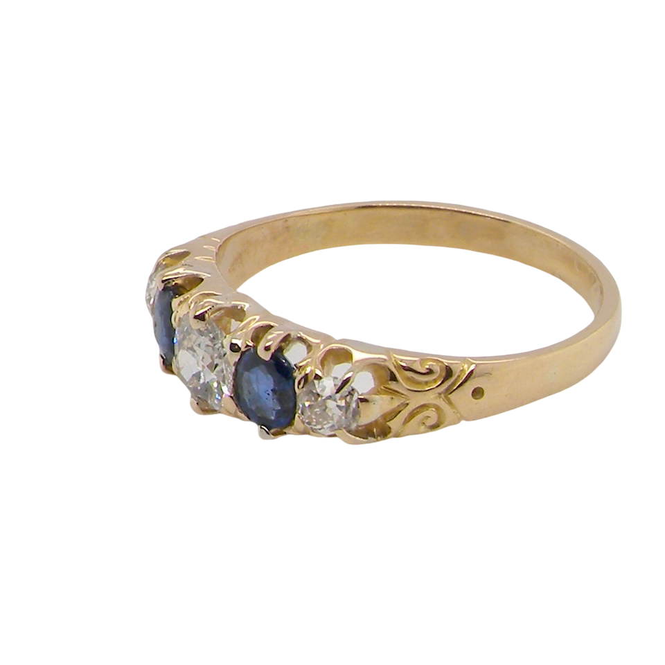 An antique ring from the early years of the 20th century. Centre stone 5mm diameter (0.50 carats) Colour H-j, clarity Si. Each side a mid colour blue sapphire 4mm diameter.
side view