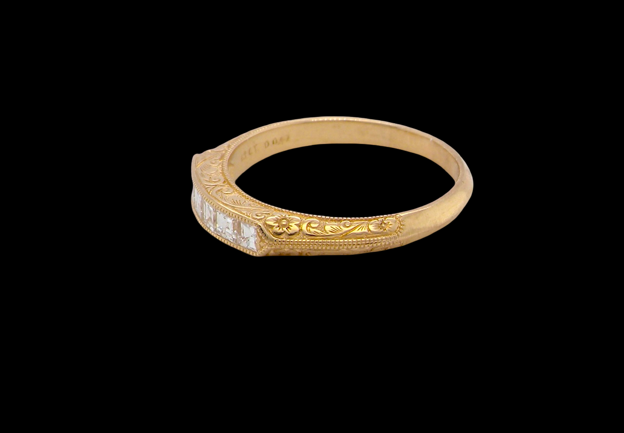side An attractive half hoop diamond eternity ring. Set with six step cut white diamonds, that sit side by side, the colour estimated at H-i, clarity Si.