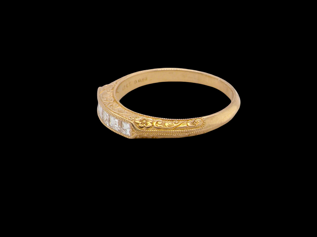 side An attractive half hoop diamond eternity ring. Set with six step cut white diamonds, that sit side by side, the colour estimated at H-i, clarity Si.