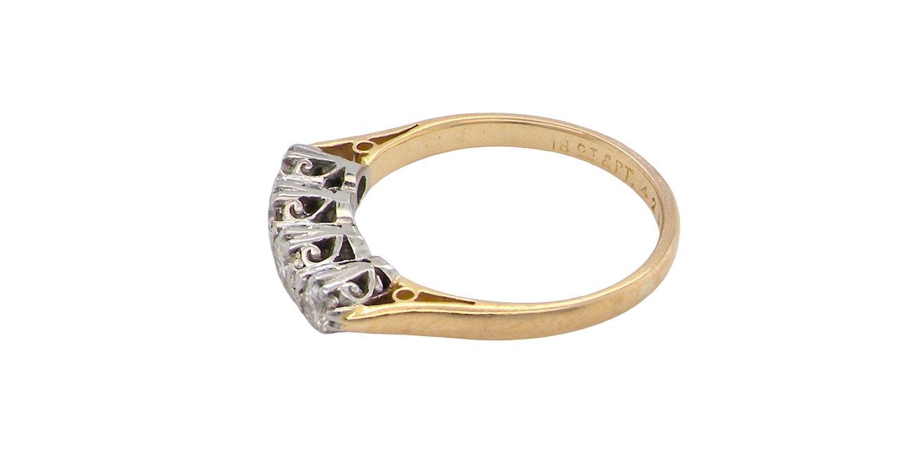 side An early 20th century ring set with diamonds.