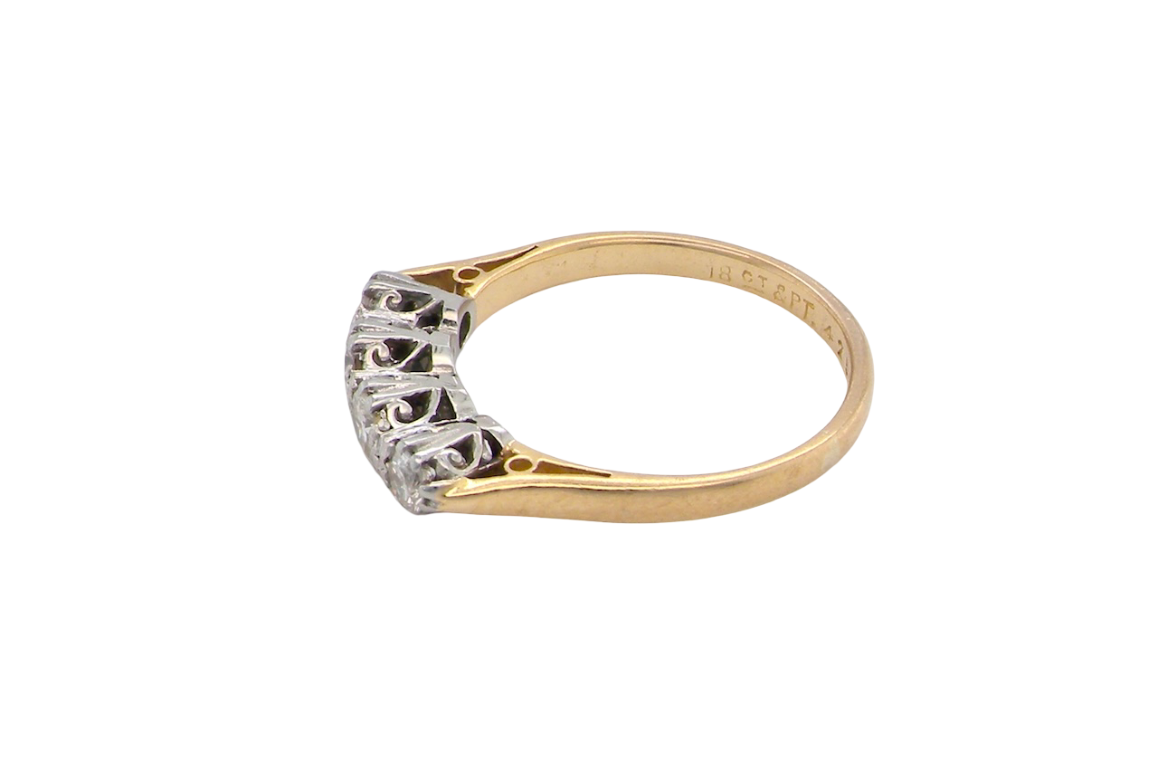 side An early 20th century ring set with diamonds.