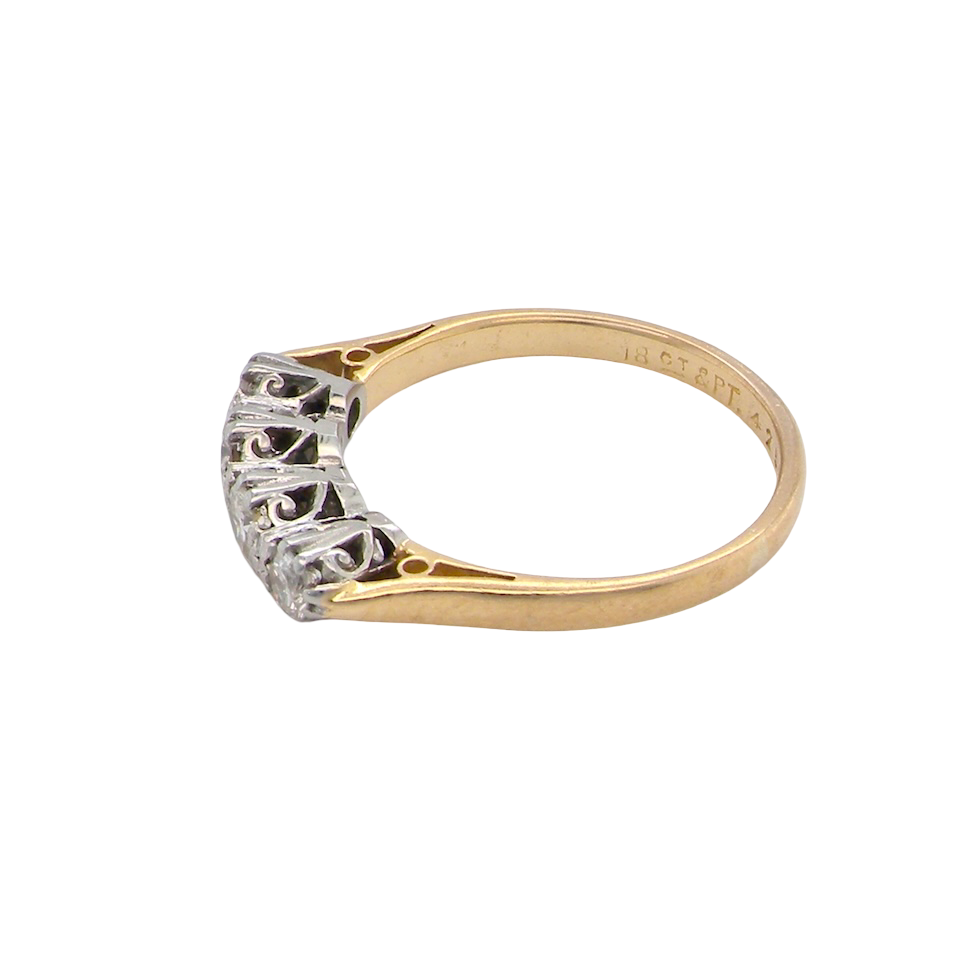 side An early 20th century ring set with diamonds.