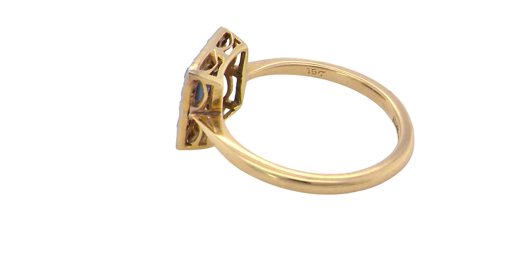 side An early 20th century square cluster ring. Features a square inky black blue sapphire, 4x4mm (est 0.25 carats) mille grain set.