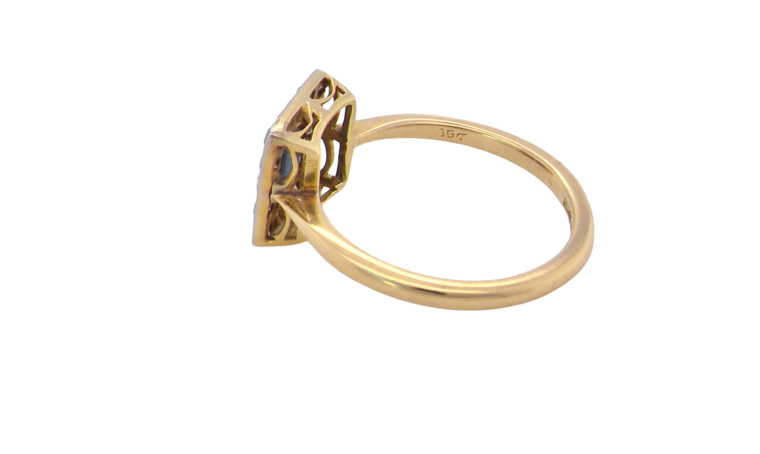 side An early 20th century square cluster ring. Features a square inky black blue sapphire, 4x4mm (est 0.25 carats) mille grain set.