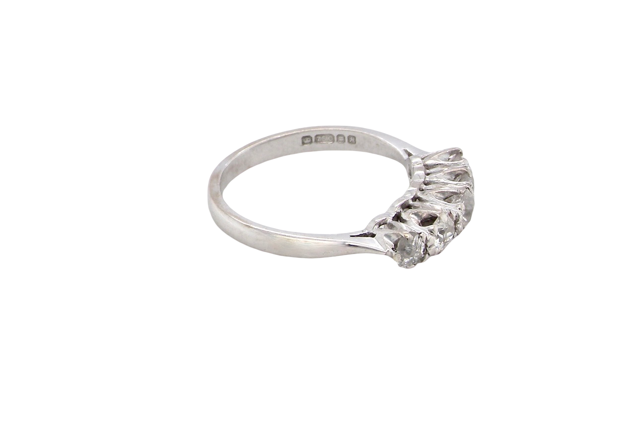 side An elegant 18 carat white gold five-stone ring set with brilliant-cut white diamonds. The centre diamond measures 3.4mm, flanked by two 3.0mm stones and finished with 2.8mm diamonds at each end, creating a beautifully balanced graduated design.