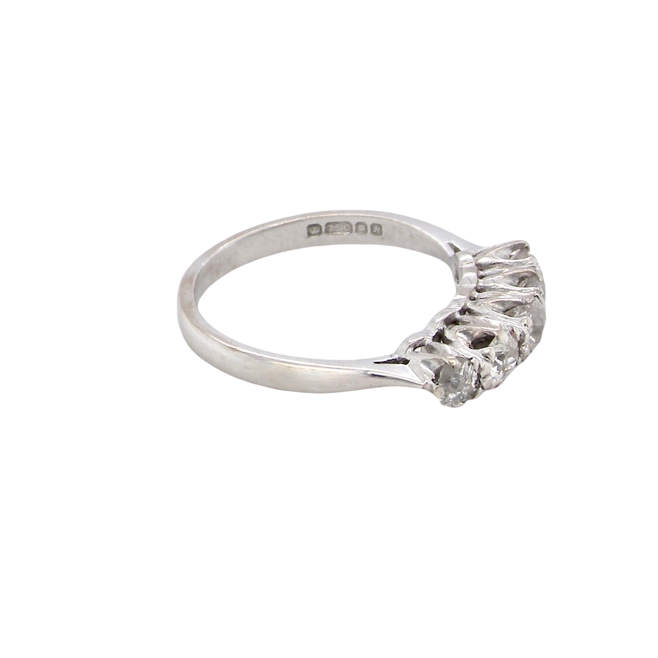 side An elegant 18 carat white gold five-stone ring set with brilliant-cut white diamonds. The centre diamond measures 3.4mm, flanked by two 3.0mm stones and finished with 2.8mm diamonds at each end, creating a beautifully balanced graduated design.
