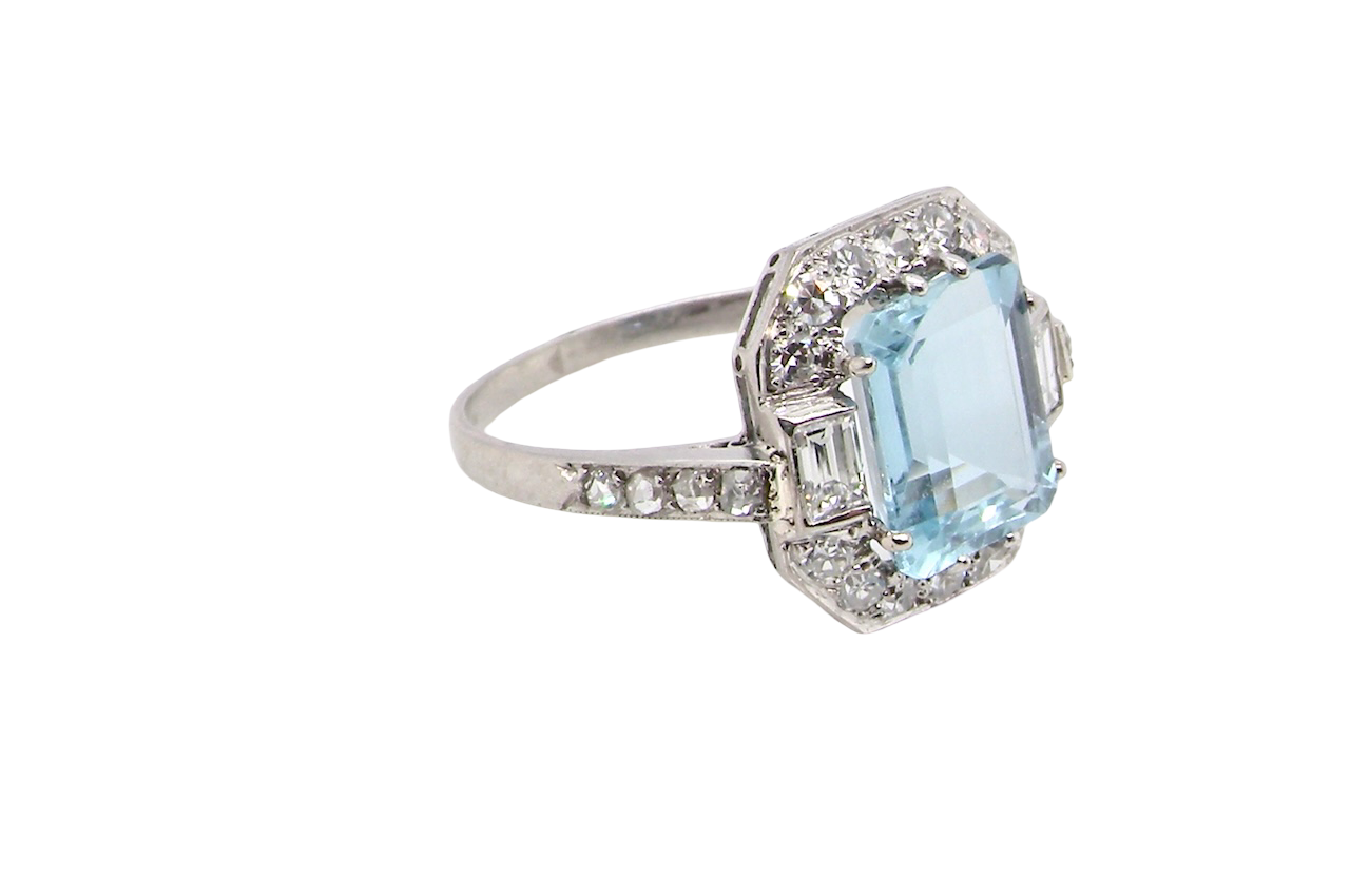 side An elegant French Art Deco cluster ring in platinum (tests as), dating to circa 1930–1940 and bearing French control marks.