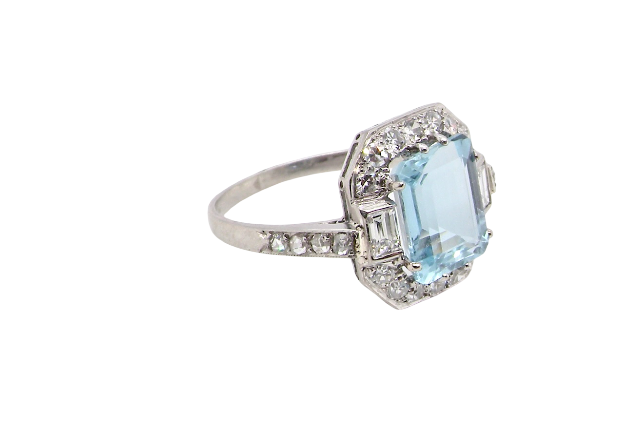 side An elegant French Art Deco cluster ring in platinum (tests as), dating to circa 1930–1940 and bearing French control marks.