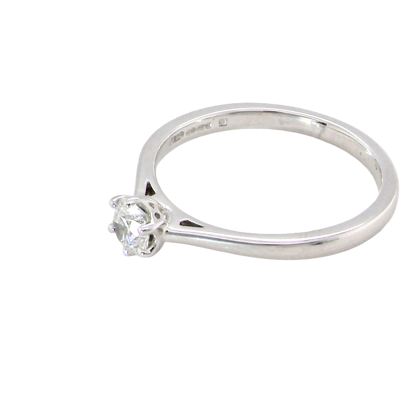 side An elegant and timeless 18 carat white gold diamond solitaire ring, featuring a beautiful brilliant cut white diamond, independently certified by the Gemological Institute of America (GIA).