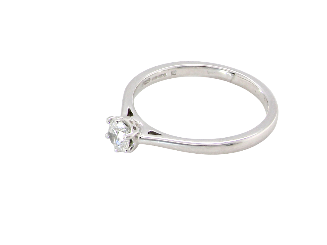 side An elegant and timeless 18 carat white gold diamond solitaire ring, featuring a beautiful brilliant cut white diamond, independently certified by the Gemological Institute of America (GIA).