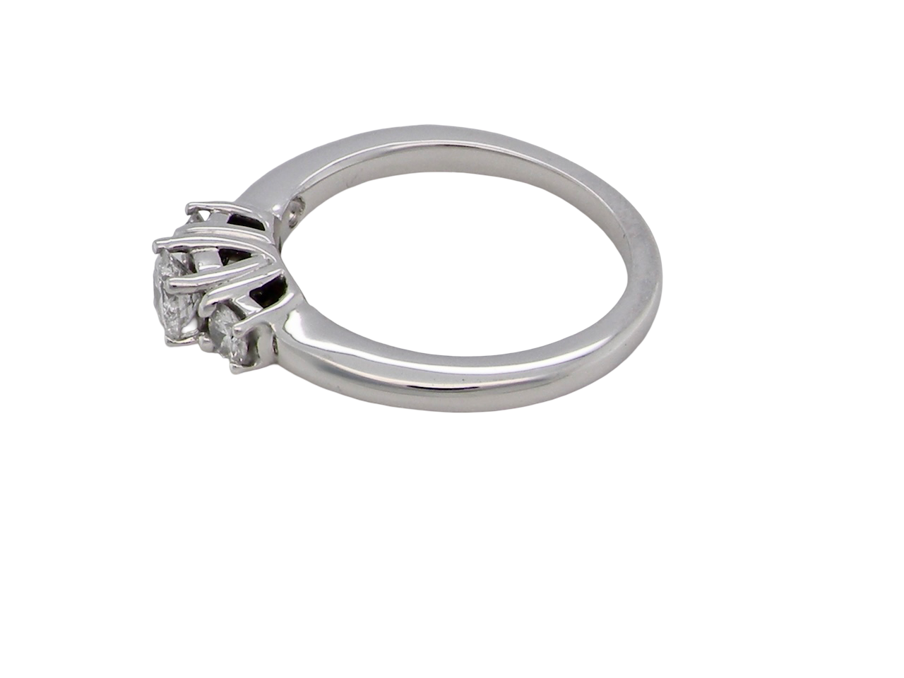 side An elegant trilogy ring set with three brilliant-cut white diamonds,