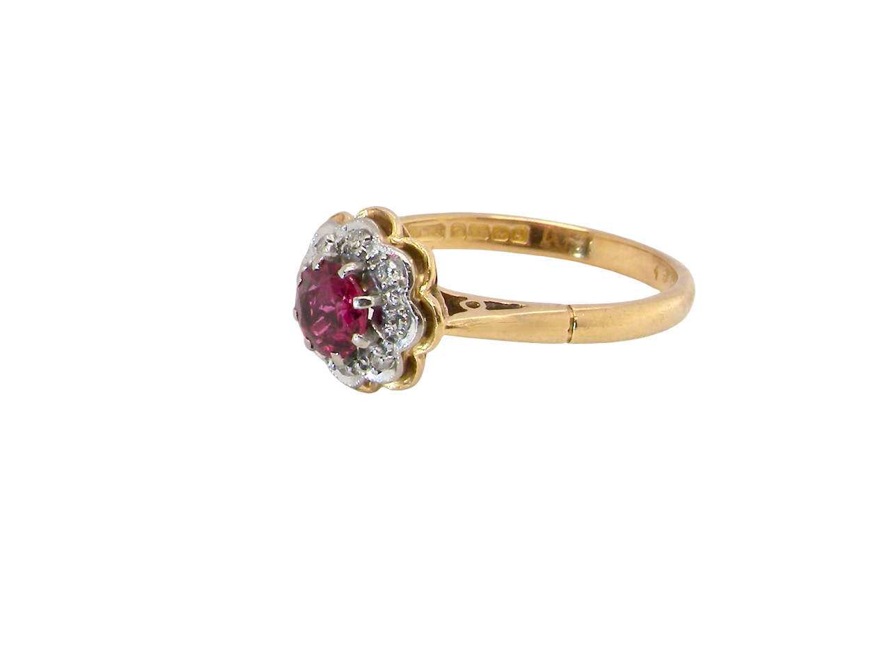 side An exquisite vintage cluster ring centred around a 5 mm ruby,( 0.50 carats)
