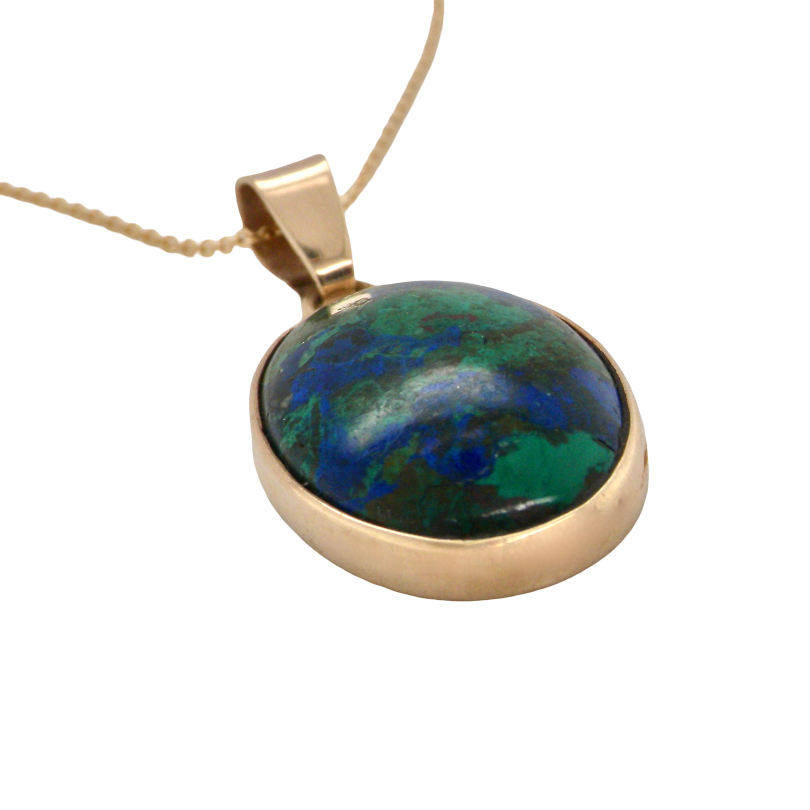 side An interesting pendant set with an azurmalachite semi precious gem stone. Measures 20x15mm. Gold rim edged setting, with a V shaped bale. (tests as 9 carat gold) 