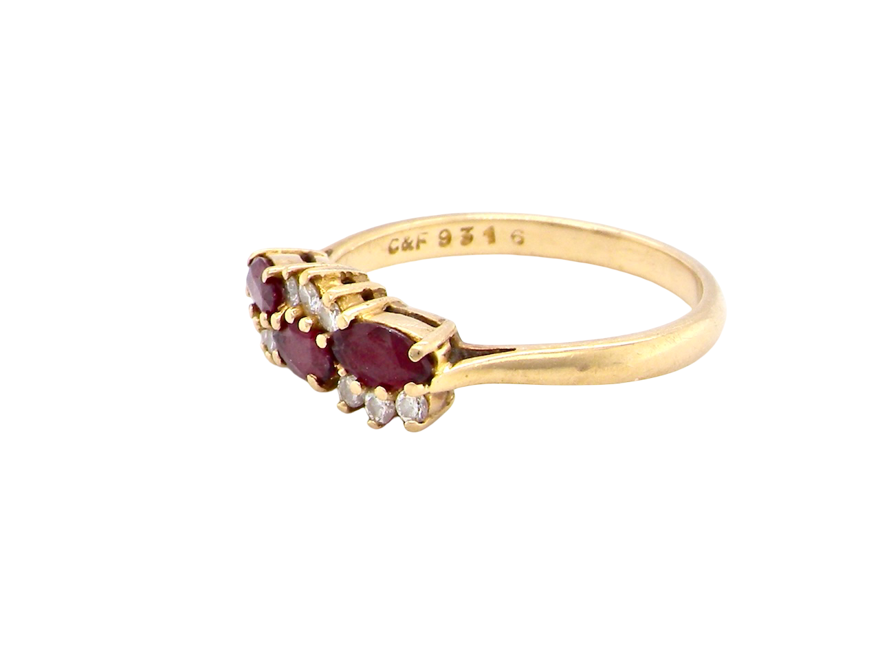 side An unusual ring featuring three marquise-cut rubies (5×3 mm each).