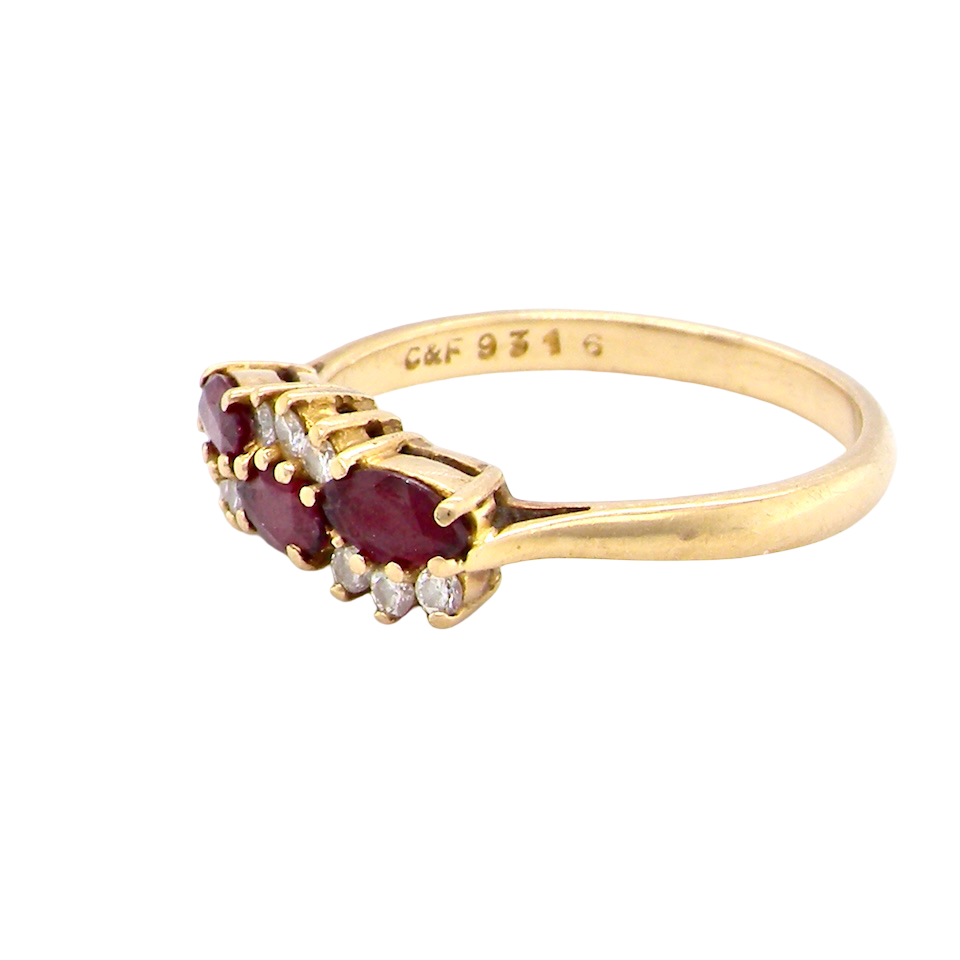 side An unusual ring featuring three marquise-cut rubies (5×3 mm each).