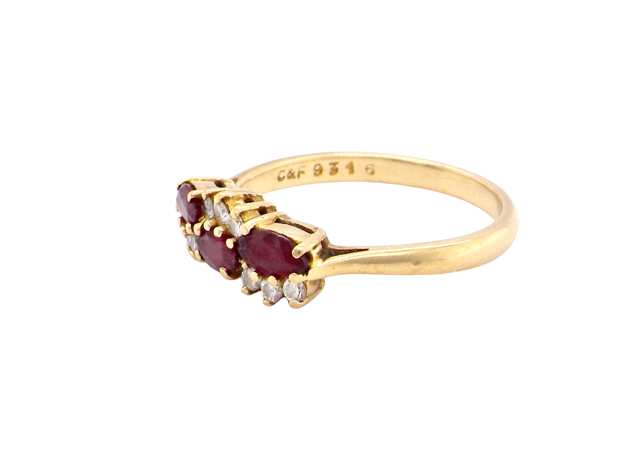 side An unusual ring featuring three marquise-cut rubies (5×3 mm each).