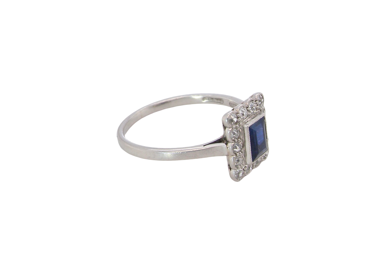 side Art Deco cluster ring. Features a cobalt blue sapphire