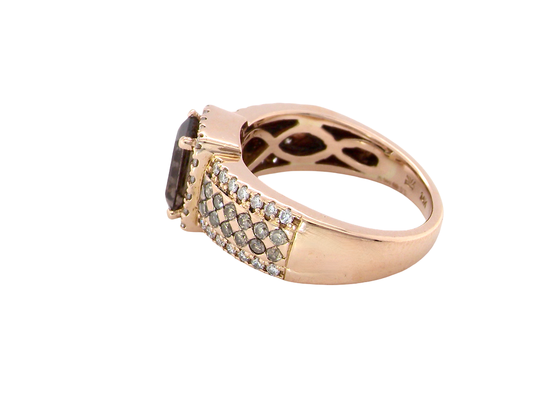 side A stunning ring from the House of Le Vien. Crafted from 14ct Strawberry Gold, this Le Vian ring is characterised by a gallery of brown/white diamonds set into each shoulder