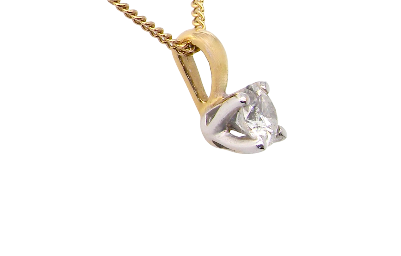 side Elegant and timeless, this solitaire diamond pendant showcases a beautifully cut 4mm round brilliant diamond, weighing 0.25 carats. The diamond features a bright H–J colour and Si clarity
