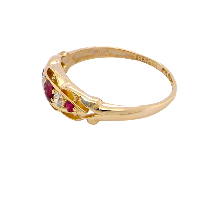 side Set with three bright rubies, centre 3x2.6mm, each end a 2mm ruby. Each side of the centre stone an old brilliant cut white diamond 2.8mm (est 0.08 carats) . Head measures 17x7mm, weight 3.4grams. 