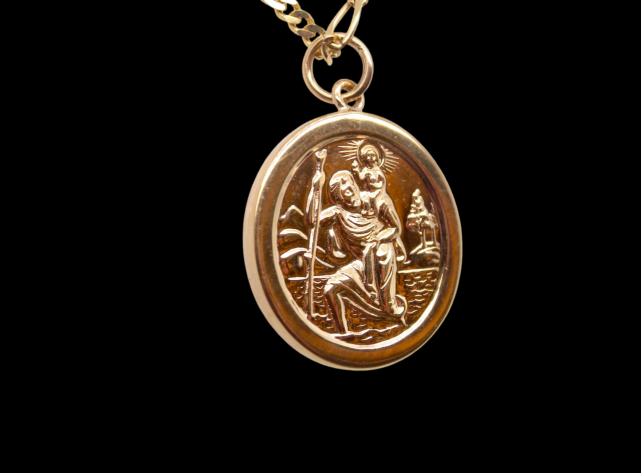 side The Patron Saint for Travellers, a gold St Christopher medallion. 
