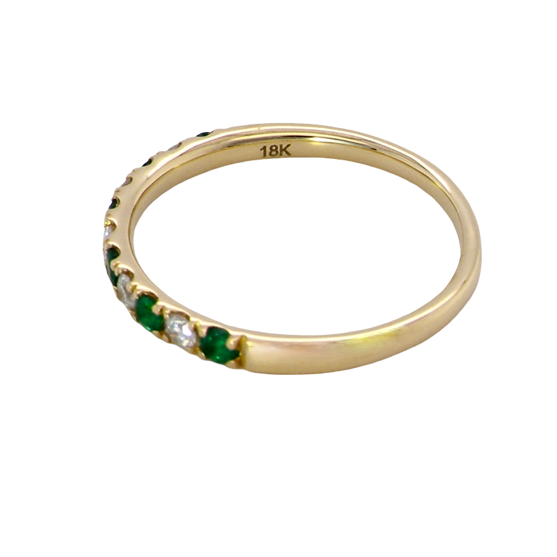 side This ring is set with six bright green emeralds, each 2mm, (est 0.25 carats) and five 2mm brilliant cut white diamonds.