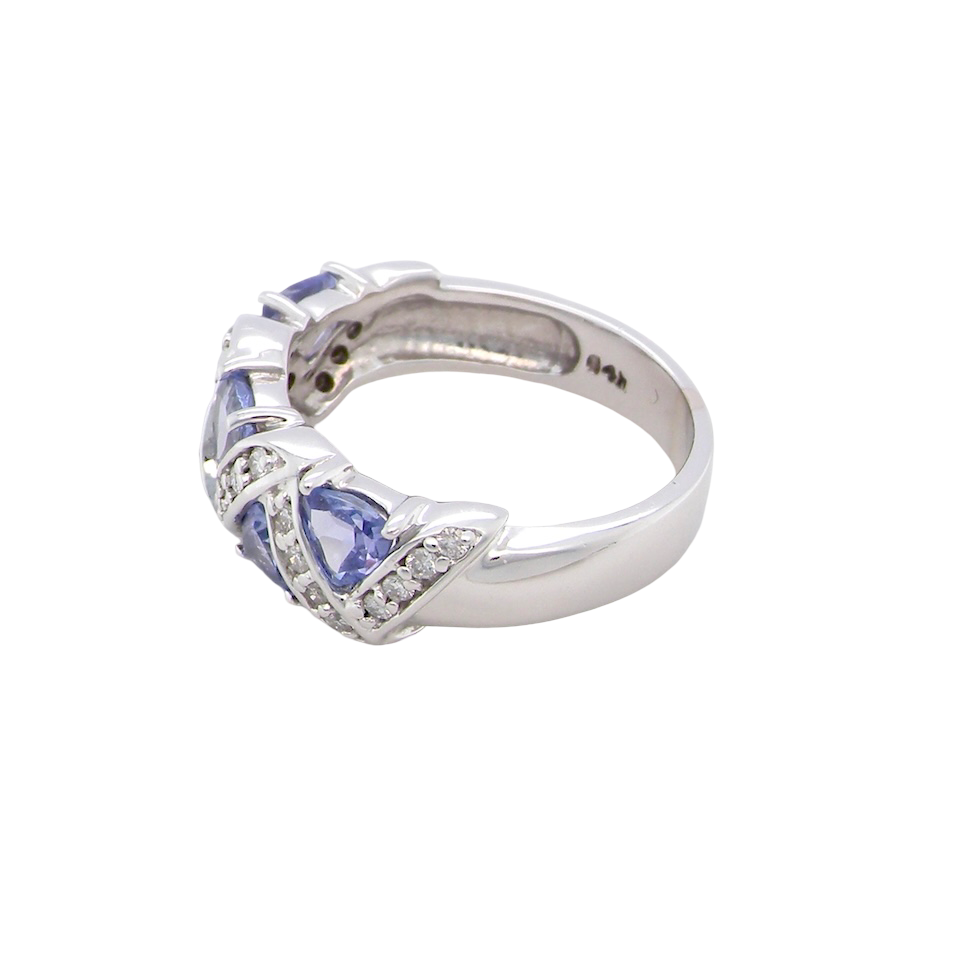 side beautiful and eye-catching dress ring set in 14ct white gold, featuring five triangular tanzanite gemstones