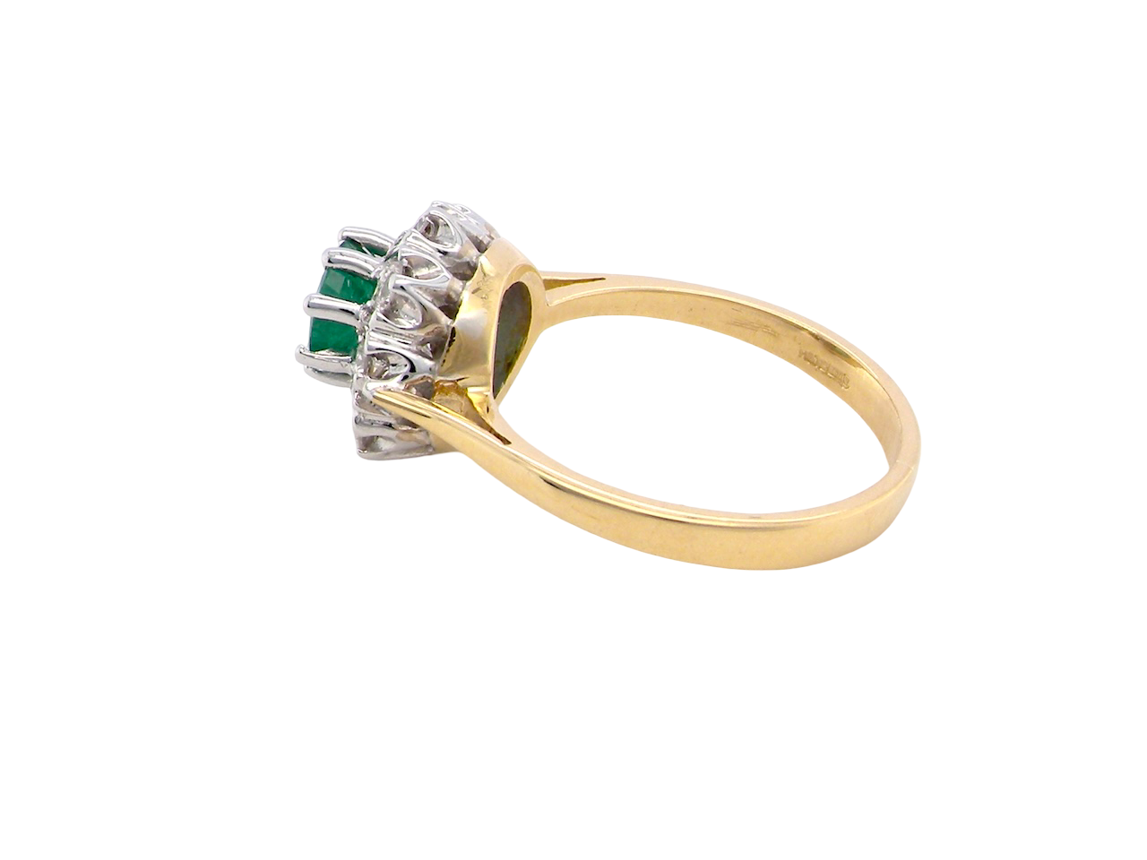 side beautiful cluster ring featuring a 6mm round emerald