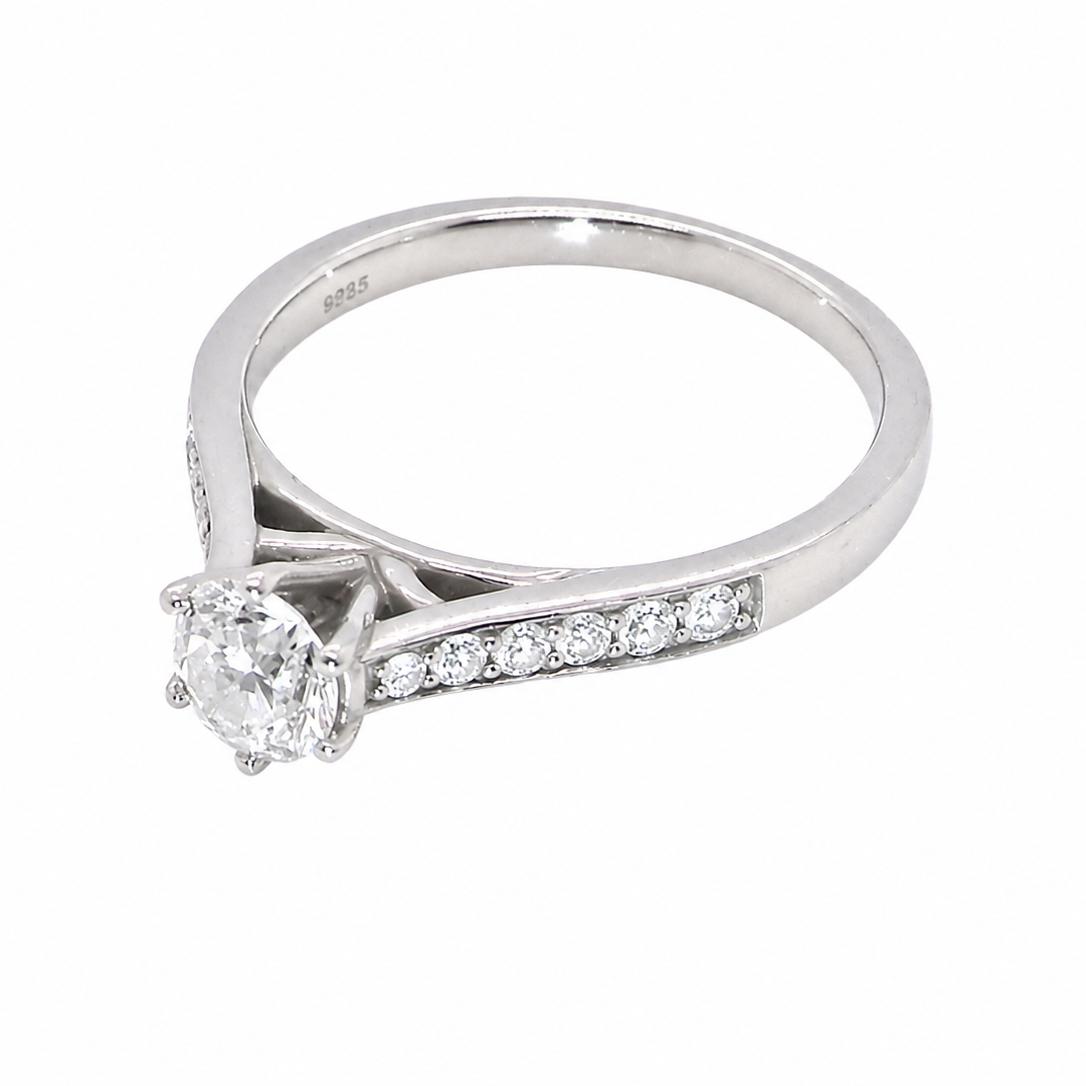 side beautiful platinum solitaire ring featuring a brilliant-cut white diamond, claw set, measuring 4.8mm and weighing approximately 0.65ct. Diamond graded I colour, SI1 clarity, with an 88-facet cut.