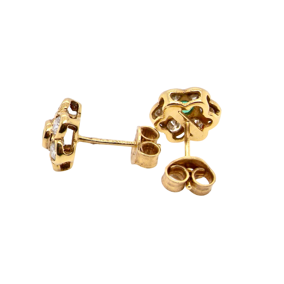 side classic cluster earrings, each featuring a round emerald