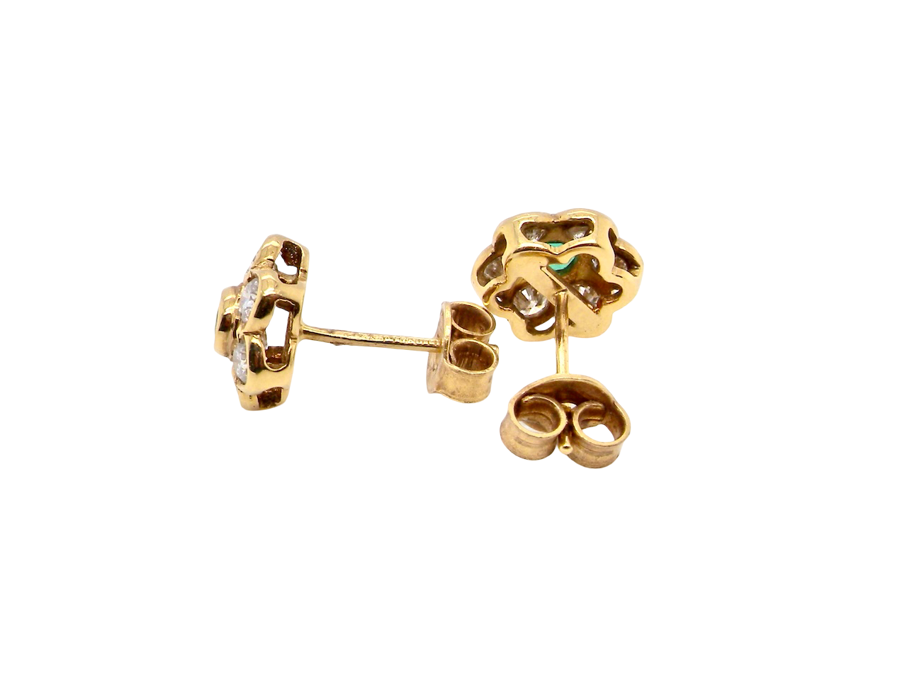 side classic cluster earrings, each featuring a round emerald