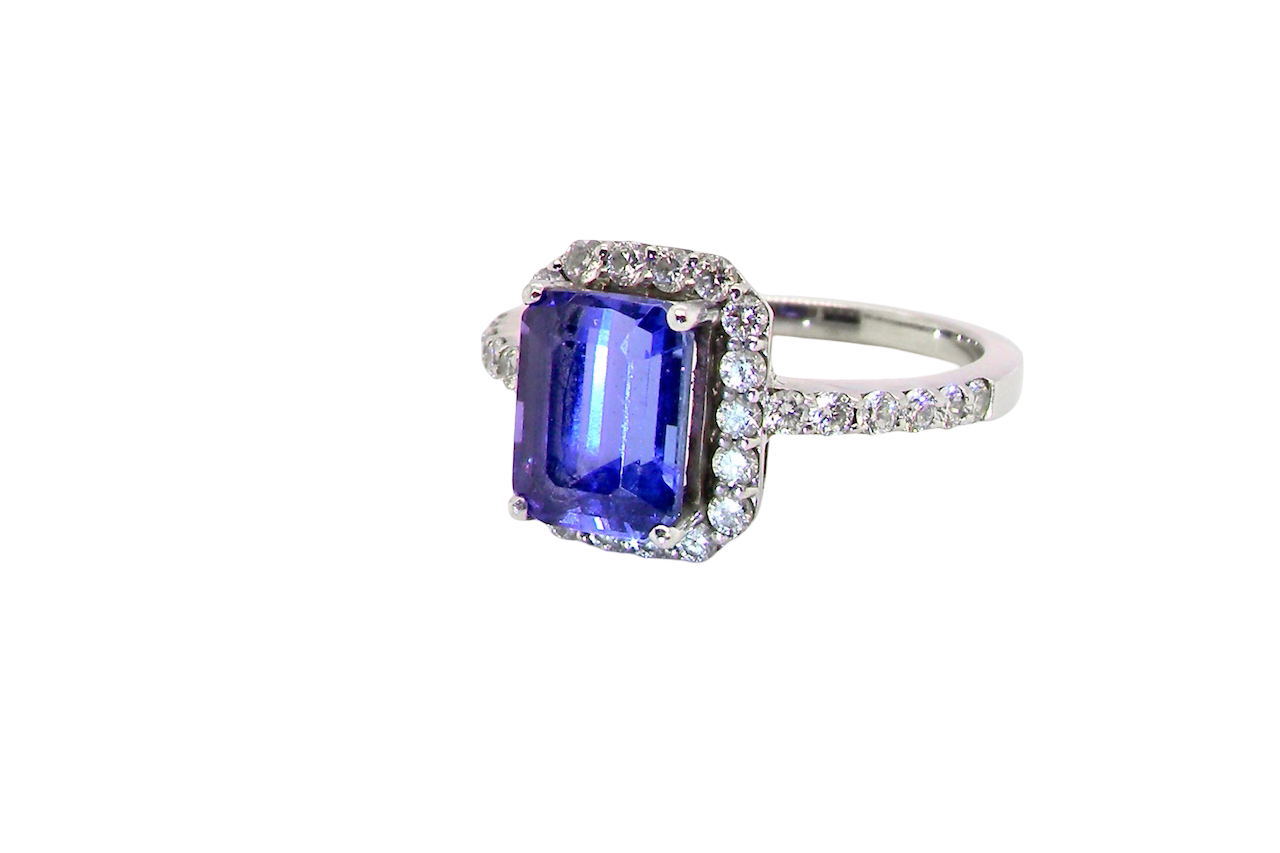 side cluster ring featuring a 4A quality Tanzanite as its centre stone.