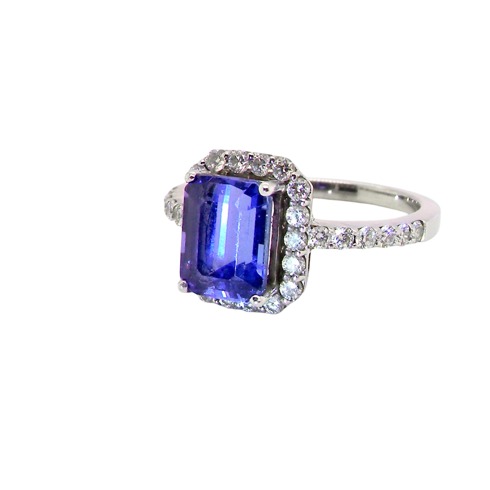 side cluster ring featuring a 4A quality Tanzanite as its centre stone.