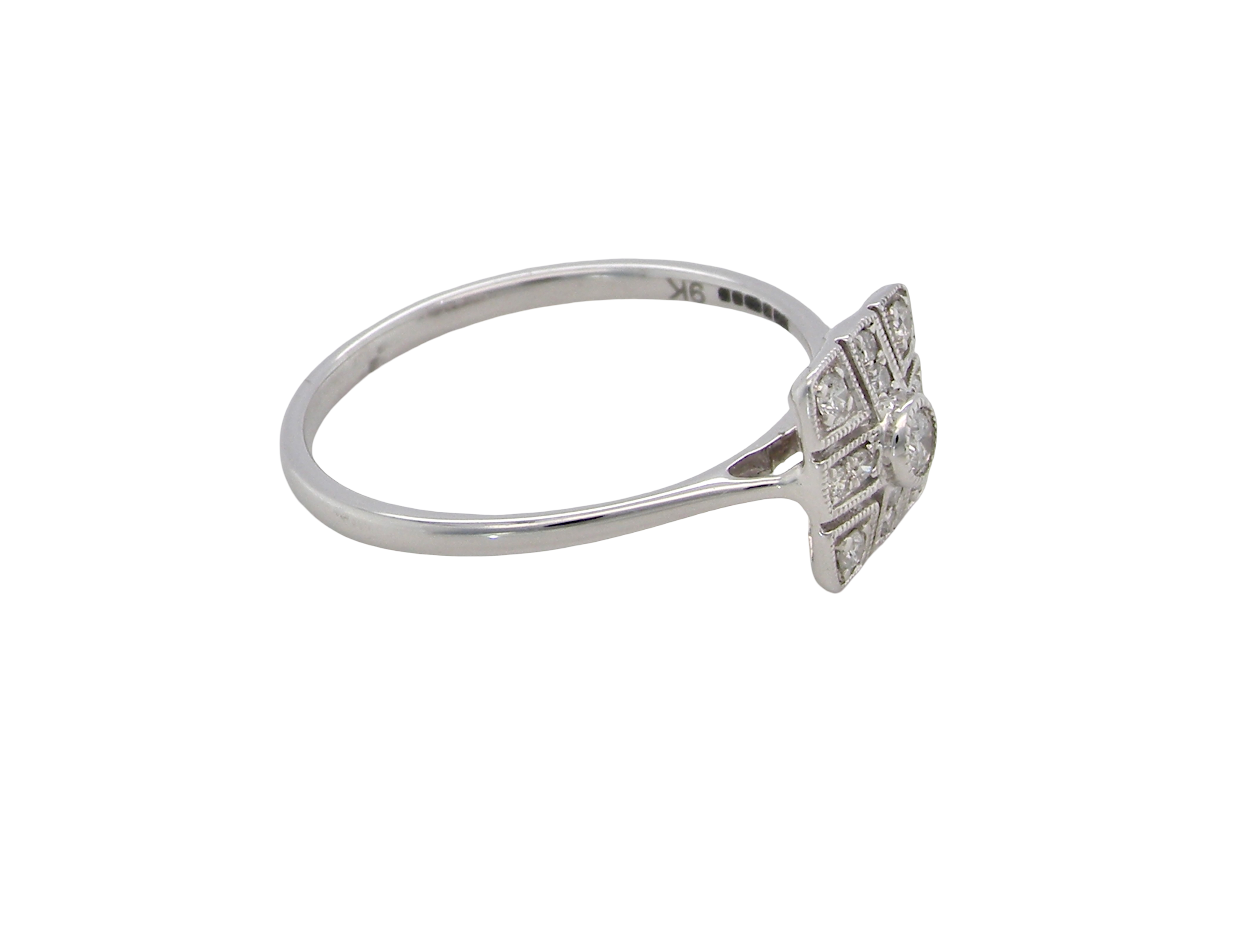 side diamond cluster ring that is in the Art Deco style from the 1920s.