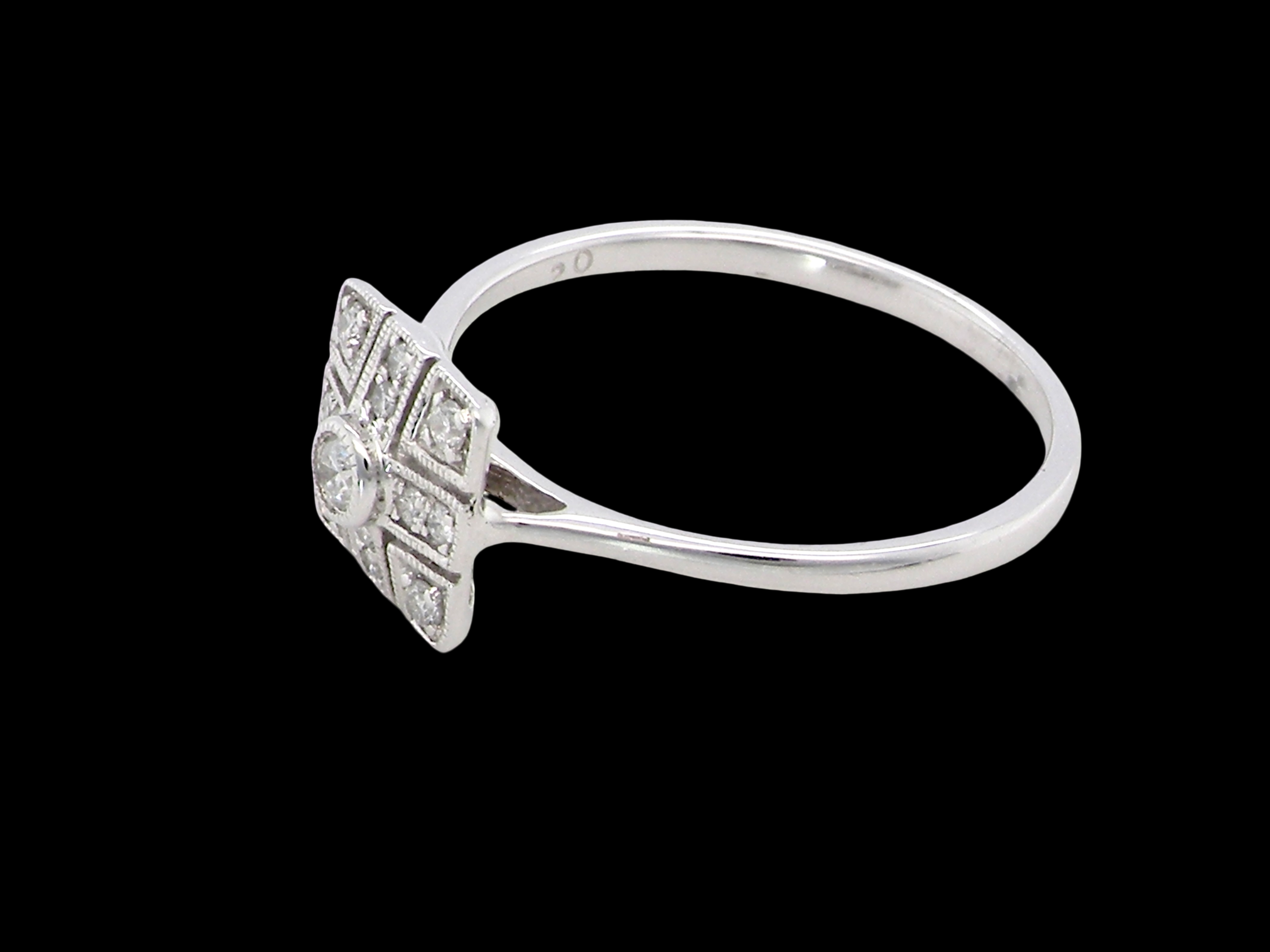 side diamond ring that is in the Art Deco style from the 1920s.