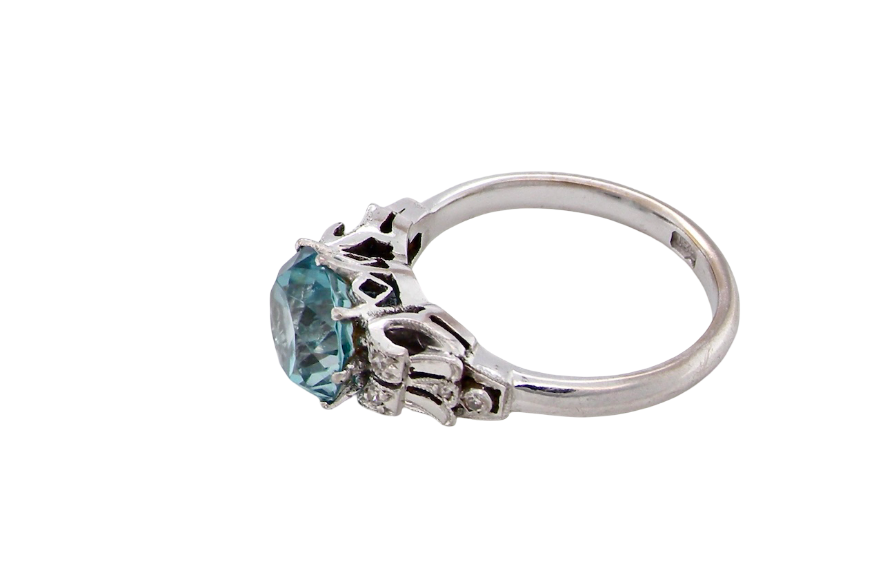 side fine Art Deco ring that features a stunning natural blue zircon centre stone