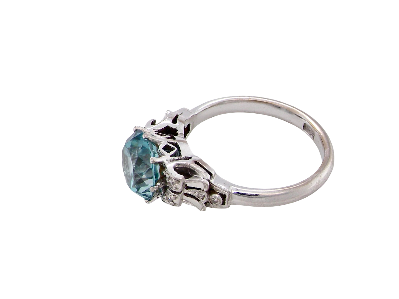 side fine Art Deco ring that features a stunning natural blue zircon centre stone
