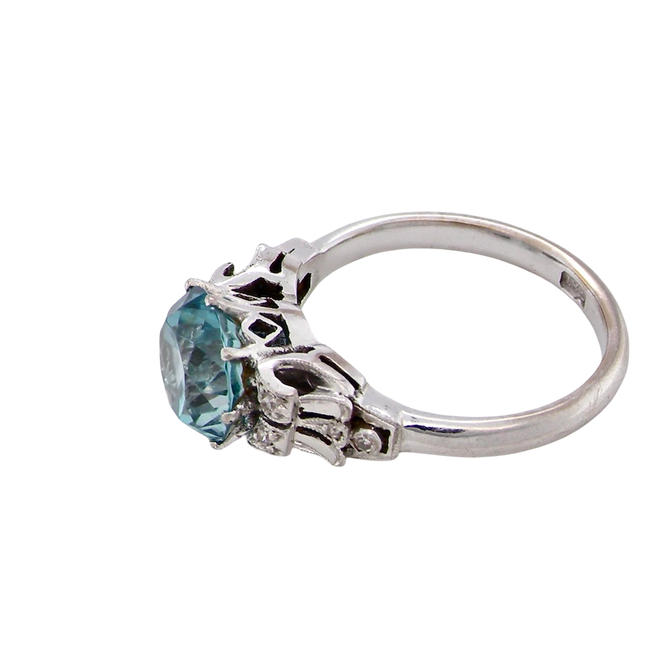 side fine Art Deco ring that features a stunning natural blue zircon centre stone