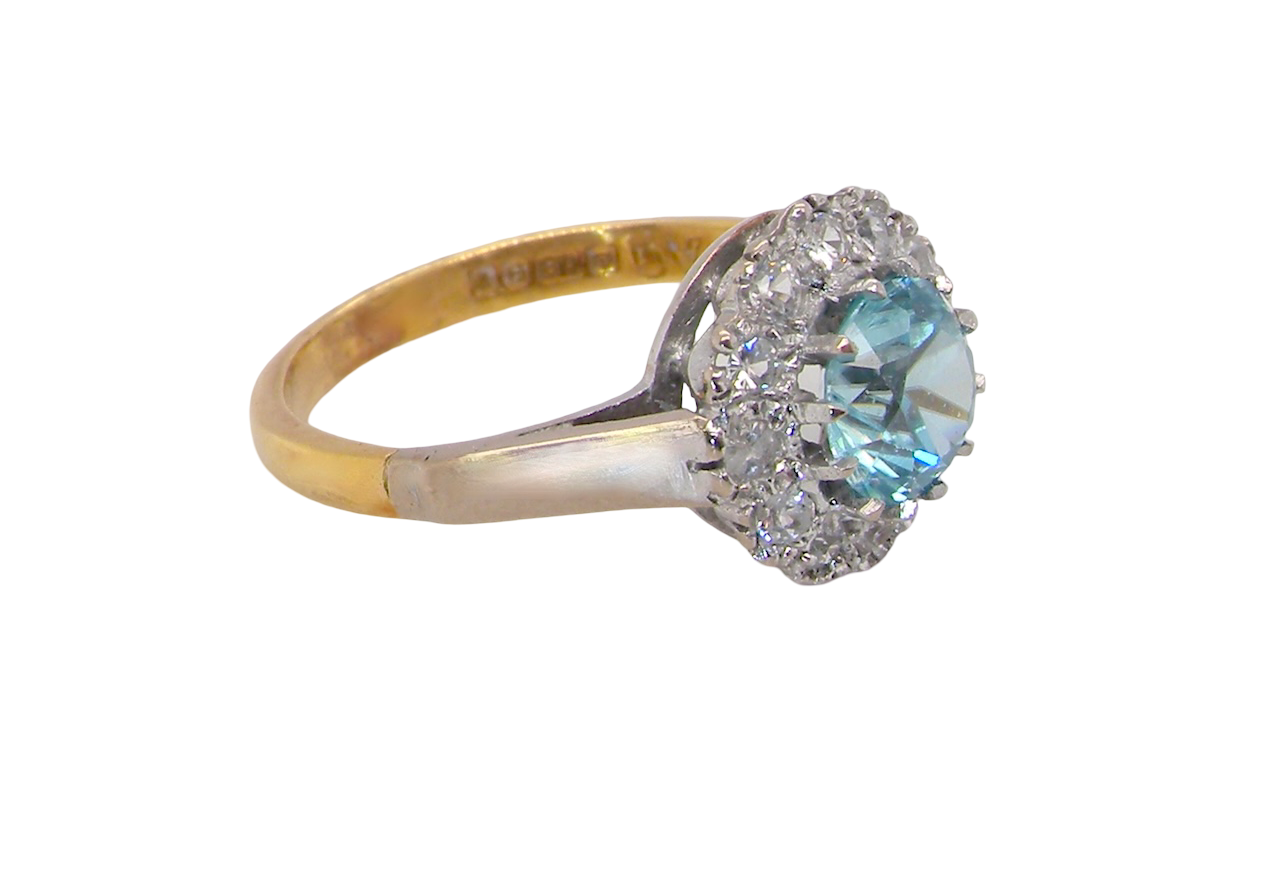 side fine vintage cluster ring. The centre stone a natural blue zircon, 7mm diameter, bright sparkling refraction to the sky blue hue. 
