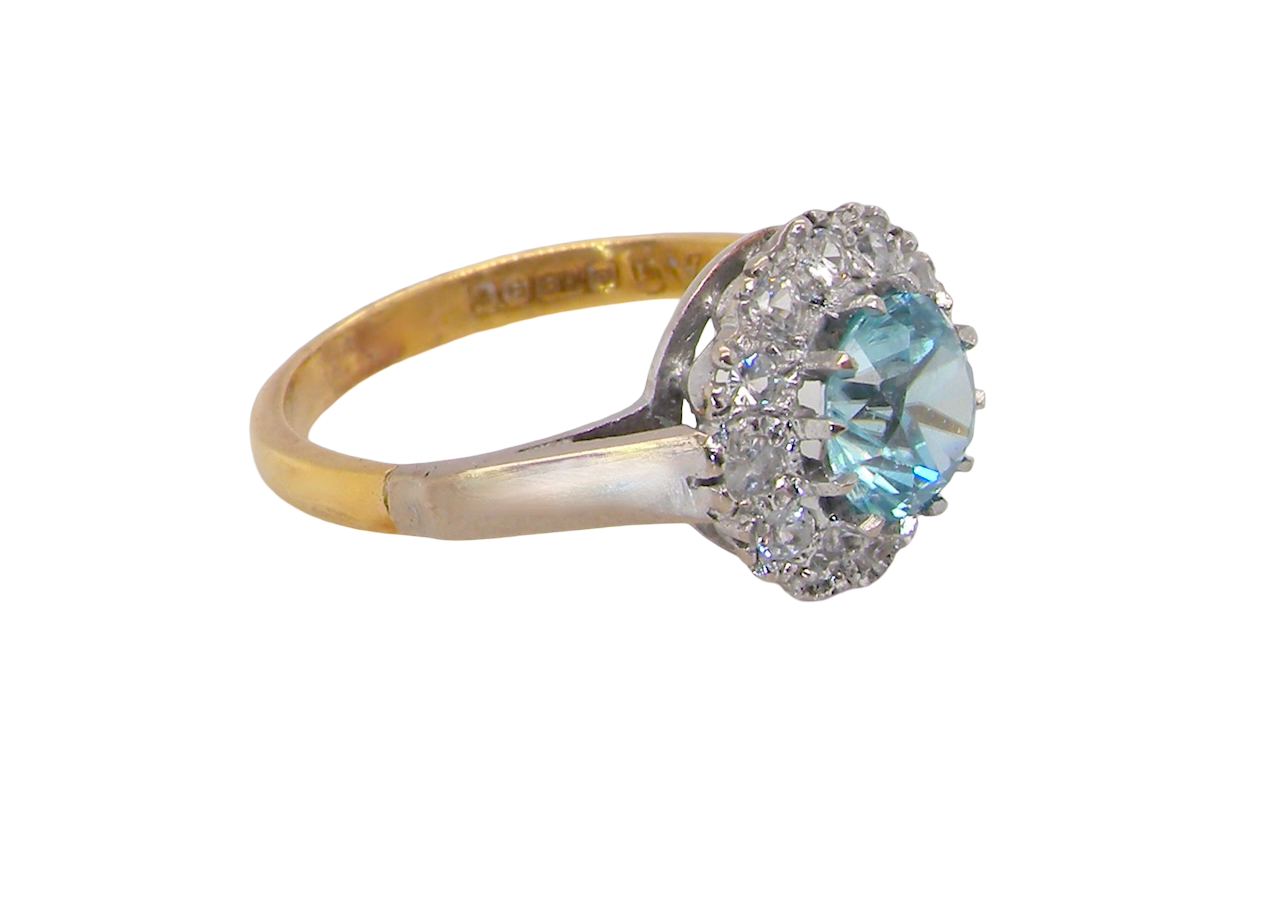 side fine vintage cluster ring. The centre stone a natural blue zircon, 7mm diameter, bright sparkling refraction to the sky blue hue. 