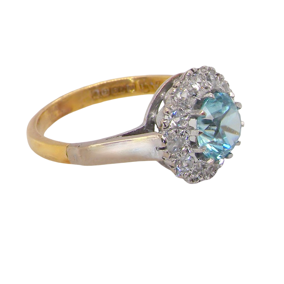 side fine vintage cluster ring. The centre stone a natural blue zircon, 7mm diameter, bright sparkling refraction to the sky blue hue. 