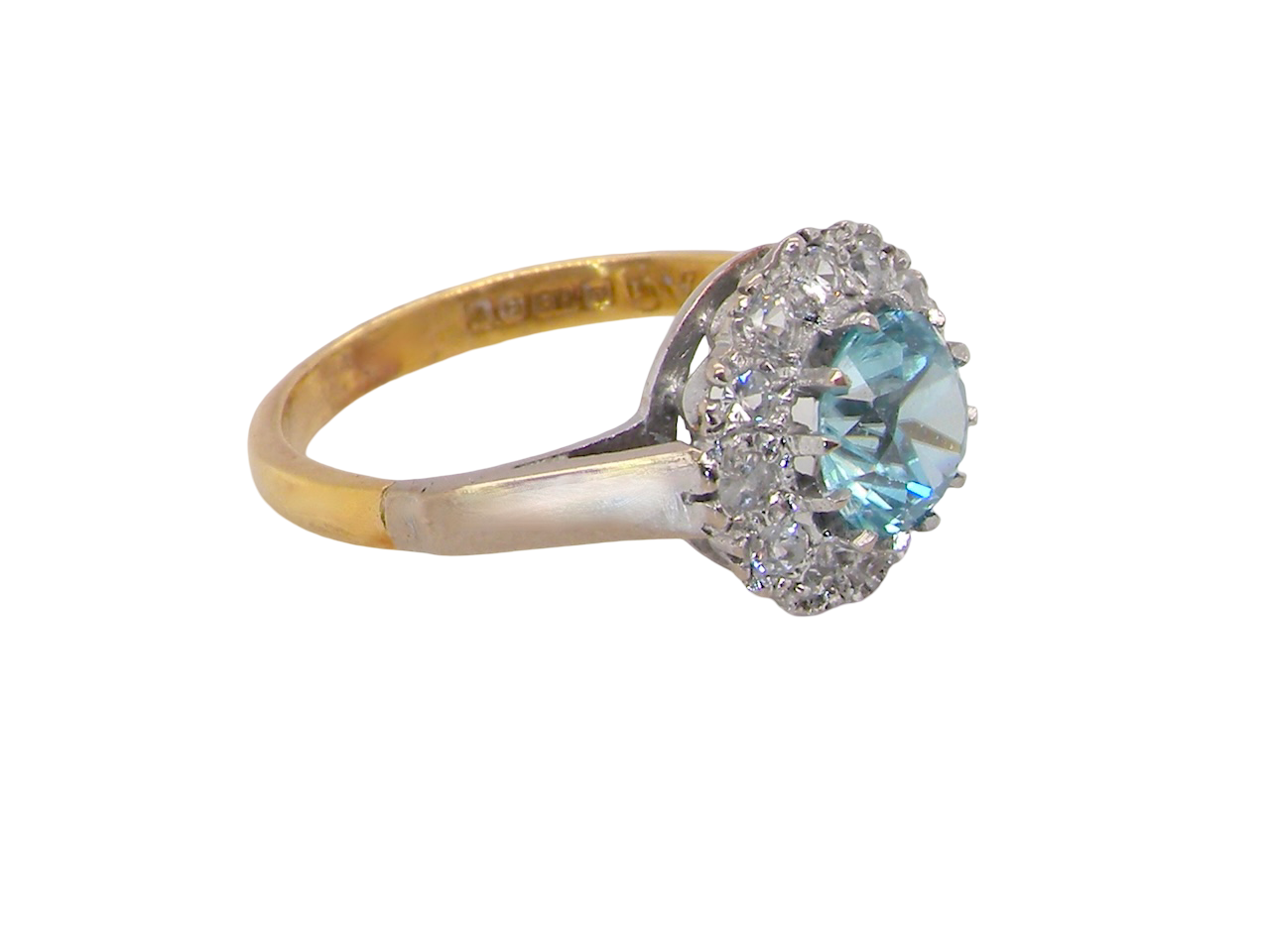 side fine vintage cluster ring. The centre stone a natural blue zircon, 7mm diameter, bright sparkling refraction to the sky blue hue. 