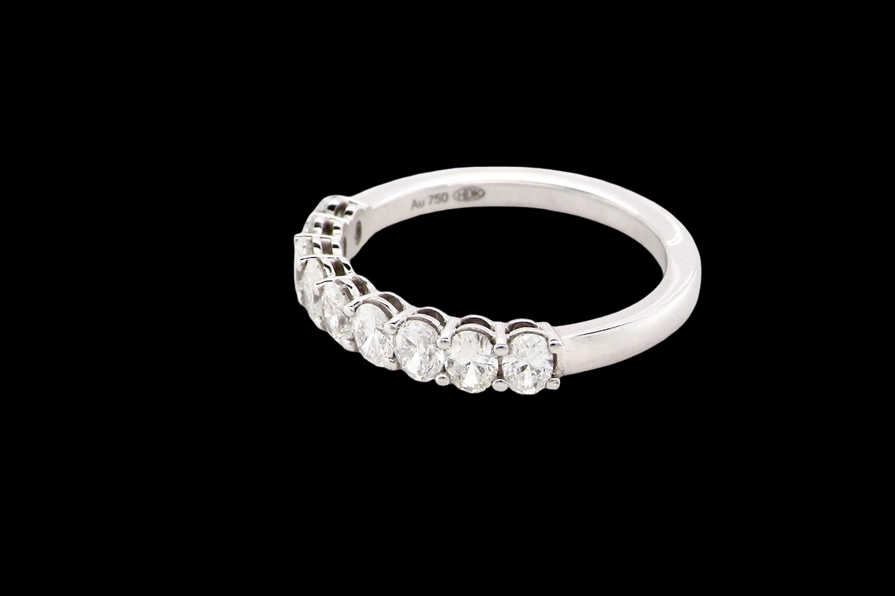 side gorgeous half-hoop eternity ring set with nine oval brilliant-cut white diamonds.